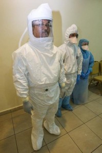 epa04450567 Medical Microbiology Science Officer Amrish Osman (L), Dr. Mazriman Wan Mansor (C) and Staff Nurse Rozahanim Sulaiman (R), wear a Personal Protective suit during a demonstration on Ebola Virus Preparedness in Putrajaya, Malaysia, 17 October 2014. The Personal Protective suit allows to treat patients with Ebola. The Malaysian government has strengthened the health screening at the entry points of the country to detect people who have visited, worked or studied in countries with Ebola infections. Until 12 October 2014, WHO have reported a total of 8,943 cases of EVD including suspected, probable and confirmed cases with 4,484 deaths.  EPA/AZHAR RAHIM