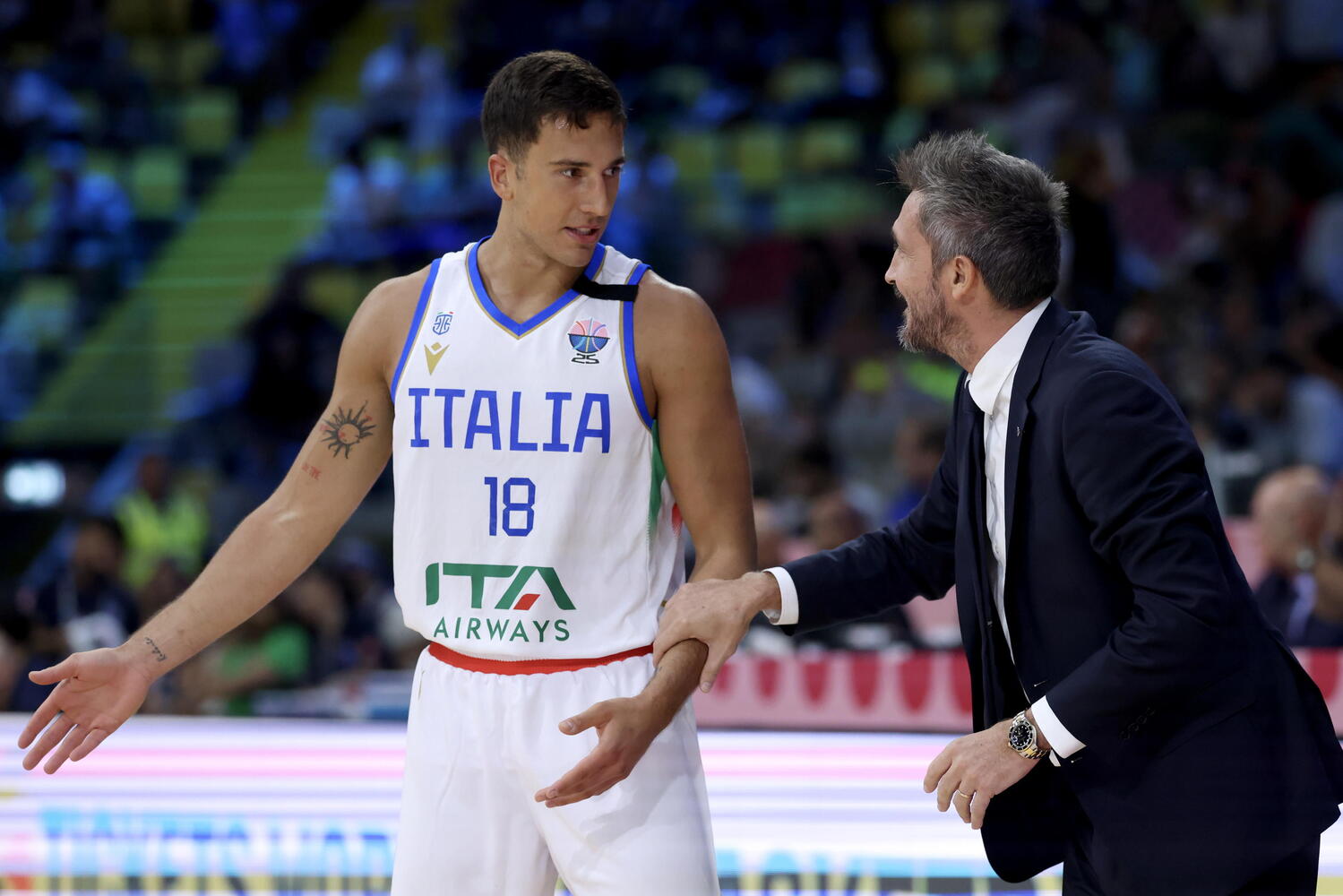 Matteo Spagnolo e coach Pozzecco